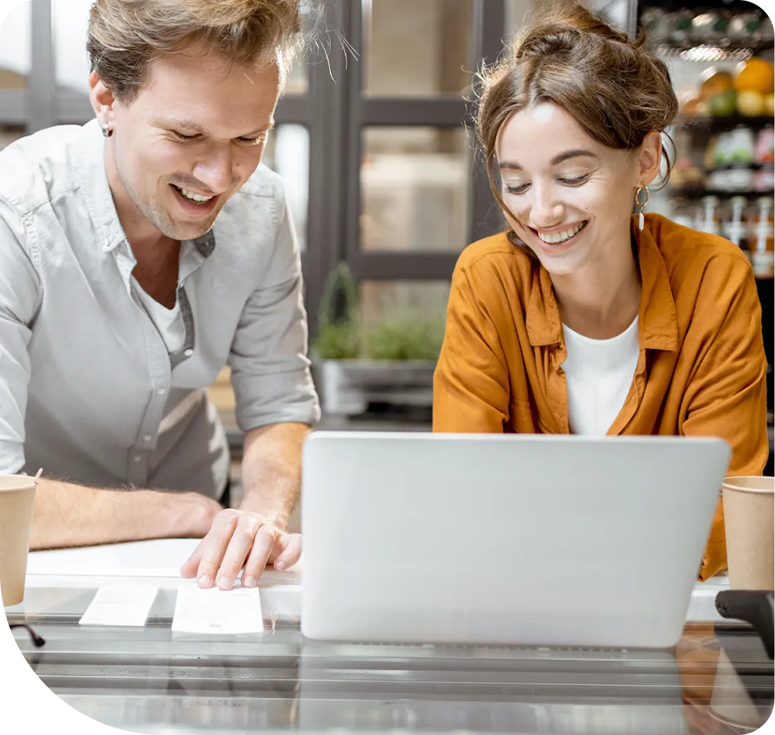 two person with a laptop