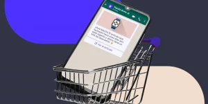 carrito de compra con un celular mostrando whatsapp